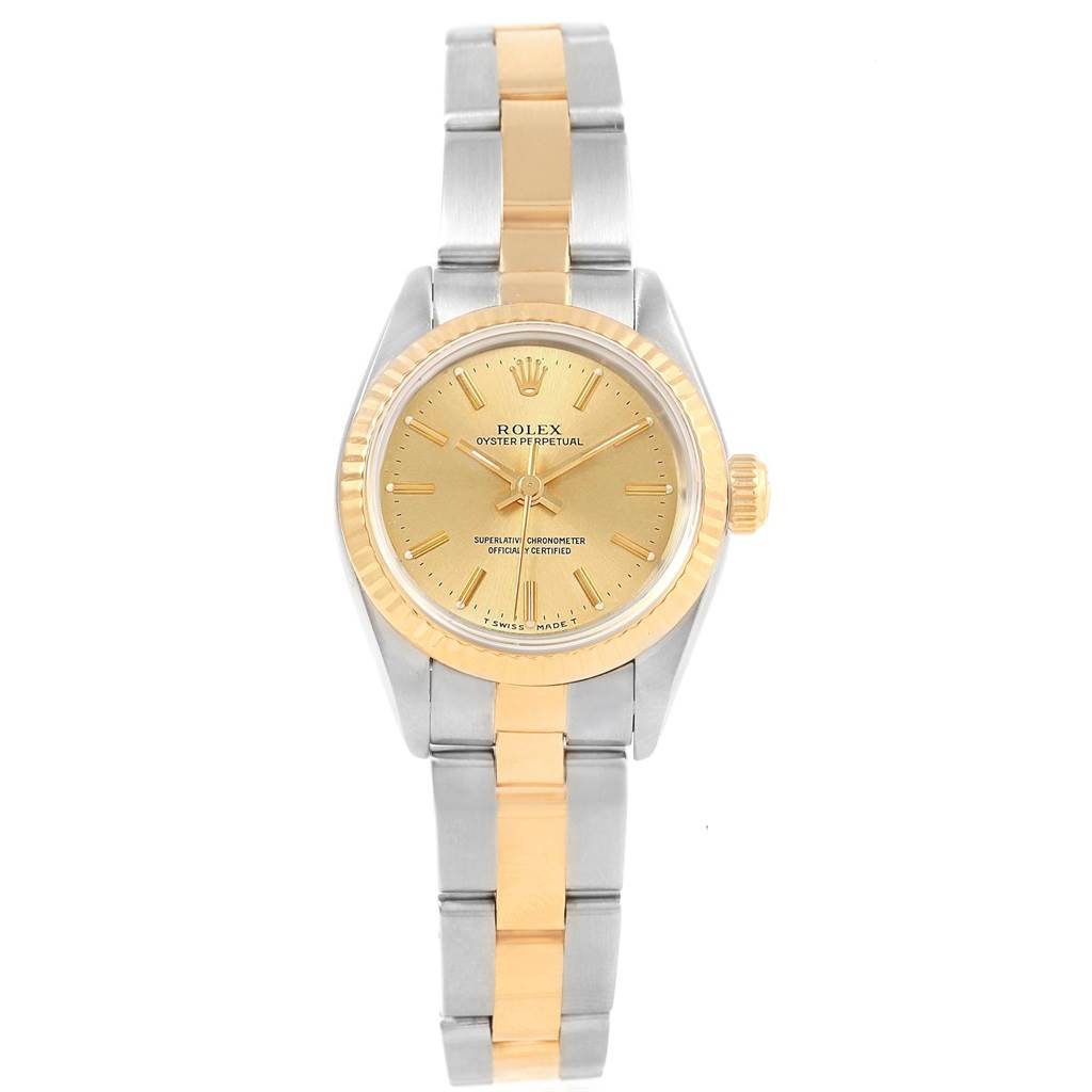 The image shows a front view of the Rolex Oyster Perpetual 67193 Women
s Steel and Gold (two tone) Champagne Dial 67193 Women
s Steel and Gold (two tone) Champagne Dial watch, highlighting its dial, bezel, and bracelet.