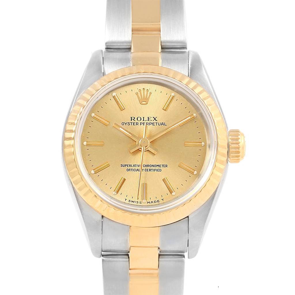 The image shows a front view of a Rolex Oyster Perpetual 67193 Women
s Steel and Gold (two tone) Champagne Dial 67193 Women
s Steel and Gold (two tone) Champagne Dial watch, displaying its dial, bezel, case, crown, and part of the bracelet.