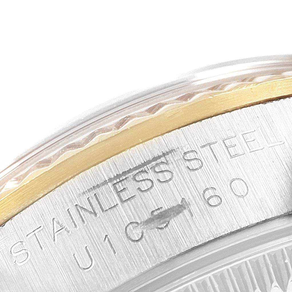 This close-up image shows the side view of the case back and bezel of the Rolex Oyster Perpetual 67193 Women
s Steel and Gold (two tone) Champagne Dial 67193 Women
s Steel and Gold (two tone) Champagne Dial watch.