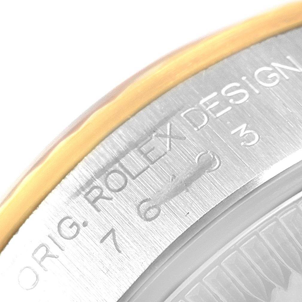 This is a close-up angle showing the engraved side case and bezel of the Rolex Oyster Perpetual 76193 Women's Steel and Gold (two tone) Grey Dial 76193 Women's Steel and Gold (two tone) Grey Dial watch.