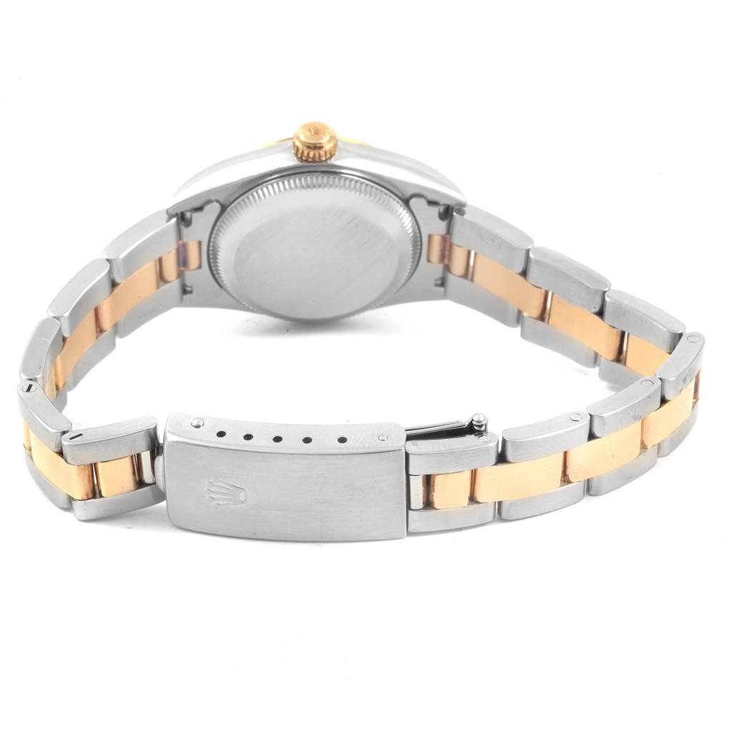The image shows the back view of a Rolex Oyster Perpetual 76193 Women's Steel and Gold (two tone) Grey Dial 76193 Women's Steel and Gold (two tone) Grey Dial watch, highlighting its case back, crown, and two-tone bracelet with clasp.