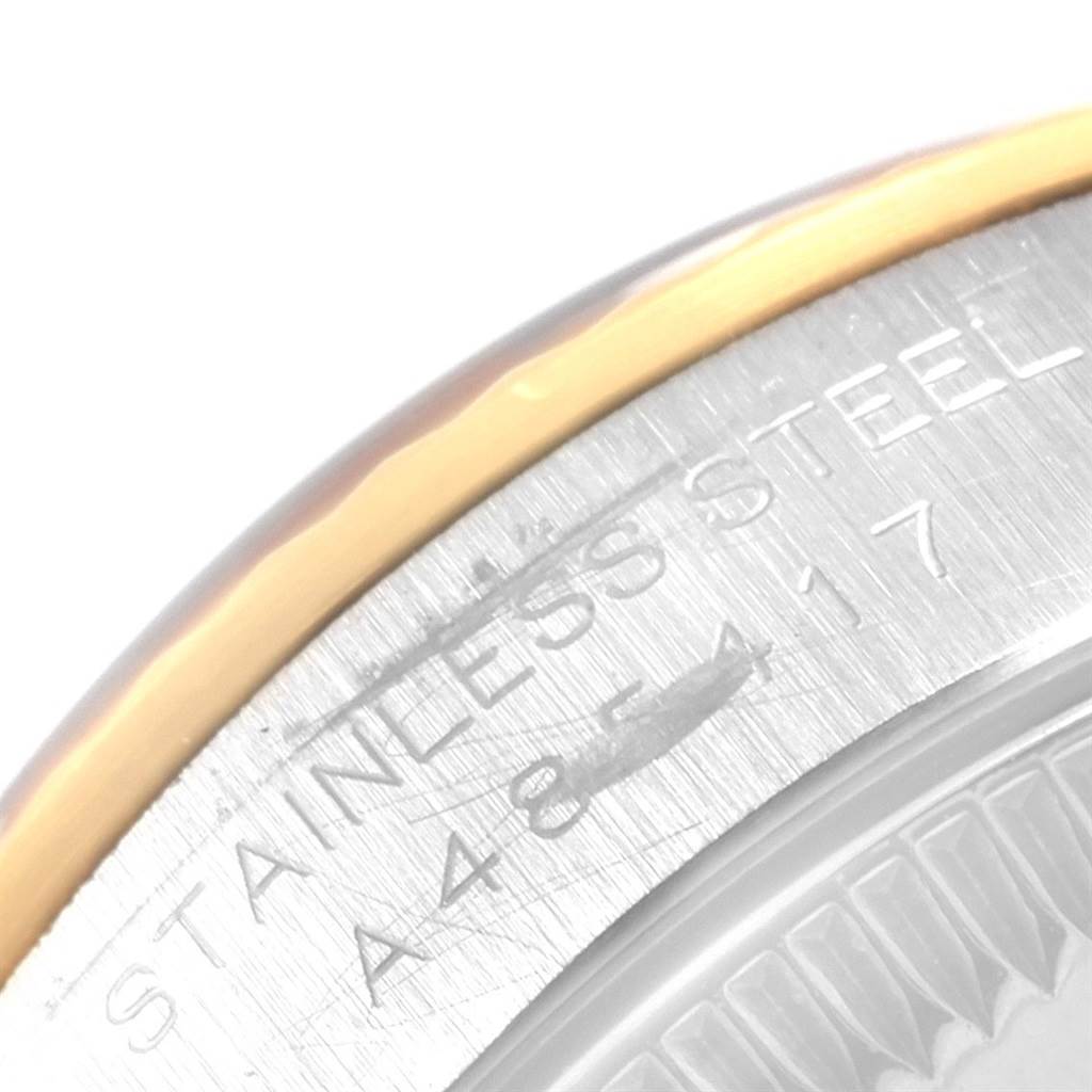 The image shows a close-up of the stainless steel case back of a Rolex Oyster Perpetual 76193 Women's Steel and Gold (two tone) Grey Dial 76193 Women's Steel and Gold (two tone) Grey Dial watch.