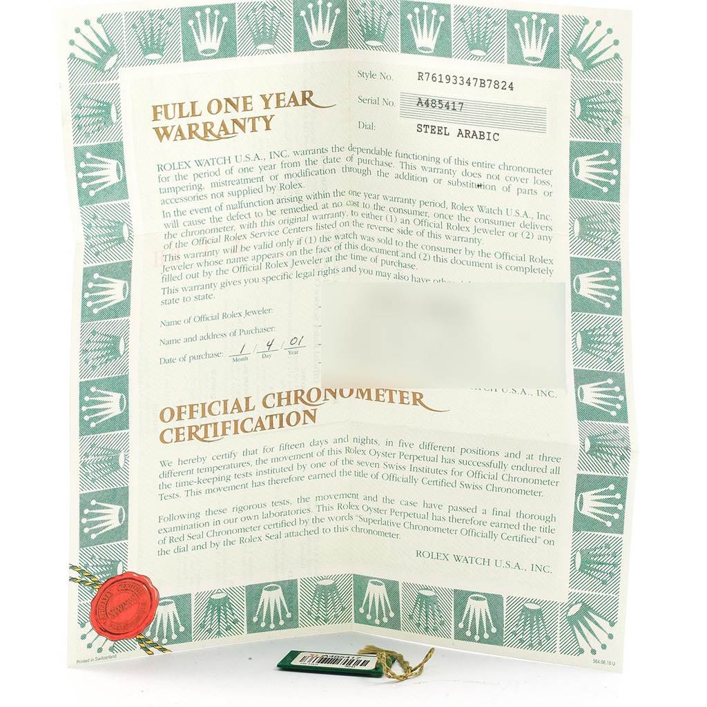 The image shows the warranty card and chronometer certification for the Rolex Oyster Perpetual 76193 Women's Steel and Gold (two tone) Grey Dial 76193 Women's Steel and Gold (two tone) Grey Dial watch at an upright angle.