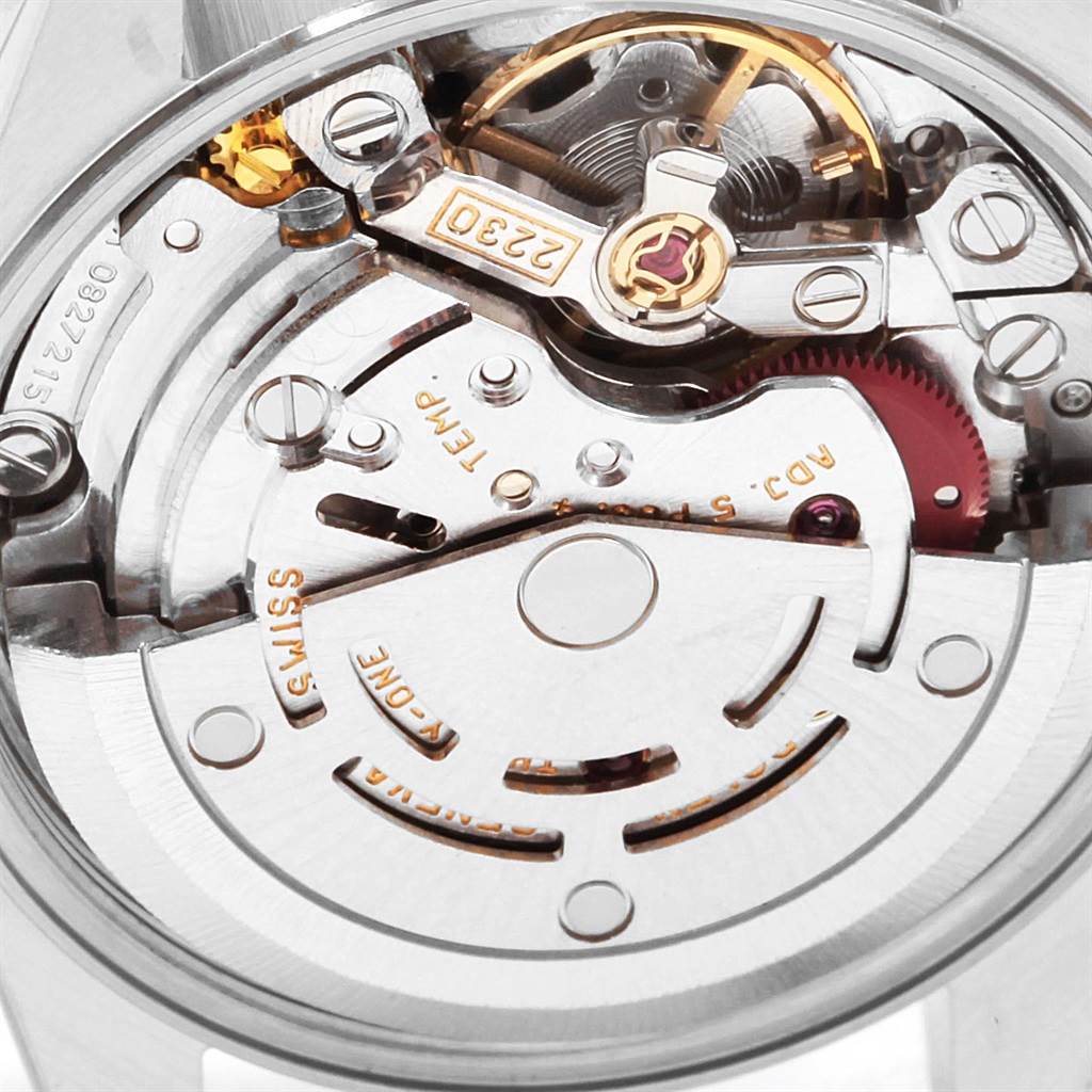 This image shows a close-up view of the movement mechanism inside the Rolex Oyster Perpetual 76030 Women
s Stainless Steel Black Dial 76030 Women
s Stainless Steel Black Dial watch.