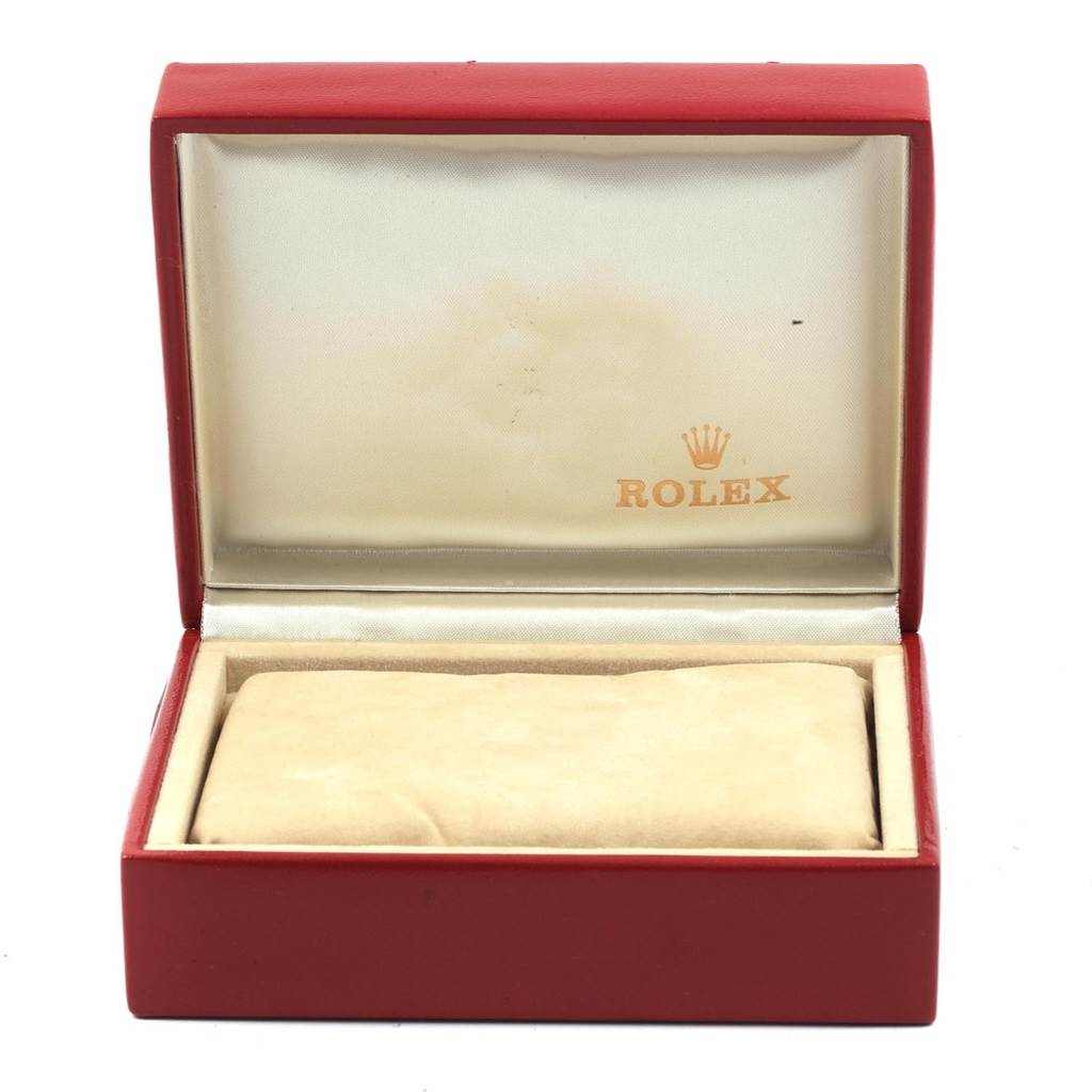 This image shows an open Rolex watch box with the cushion inside for the Oyster Perpetual model.