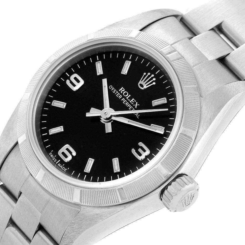 The image shows a close-up angle of the Rolex Oyster Perpetual 76030 Women
s Stainless Steel Black Dial 76030 Women
s Stainless Steel Black Dial watch, highlighting its dial, bezel, bracelet, and crown.