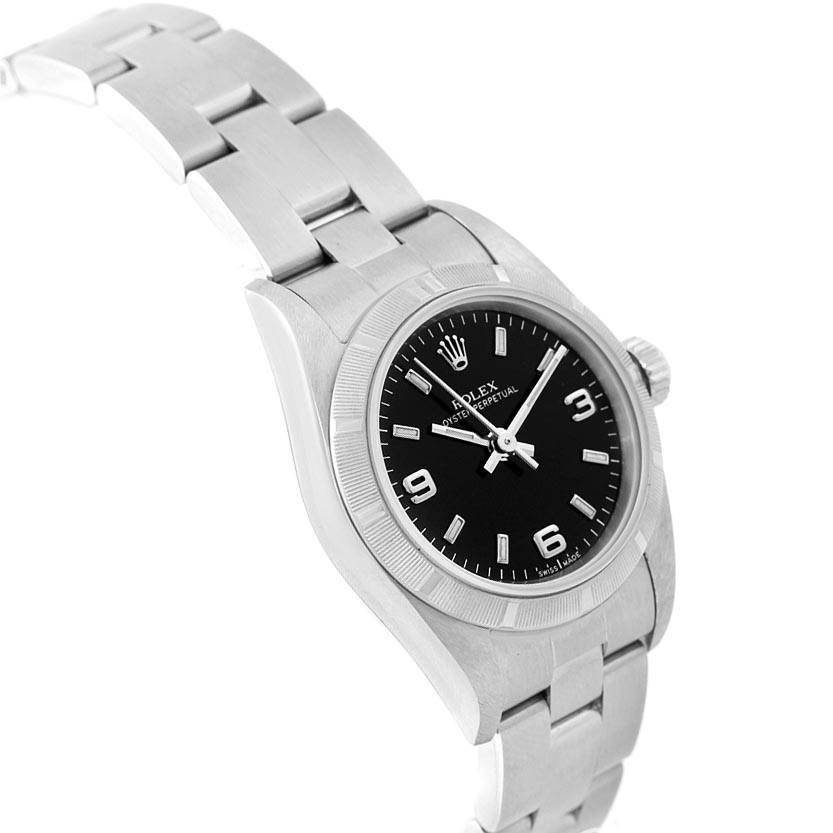 The image shows a side angle view of the Rolex Oyster Perpetual 76030 Women
s Stainless Steel Black Dial 76030 Women
s Stainless Steel Black Dial, highlighting its stainless steel bracelet and black dial.