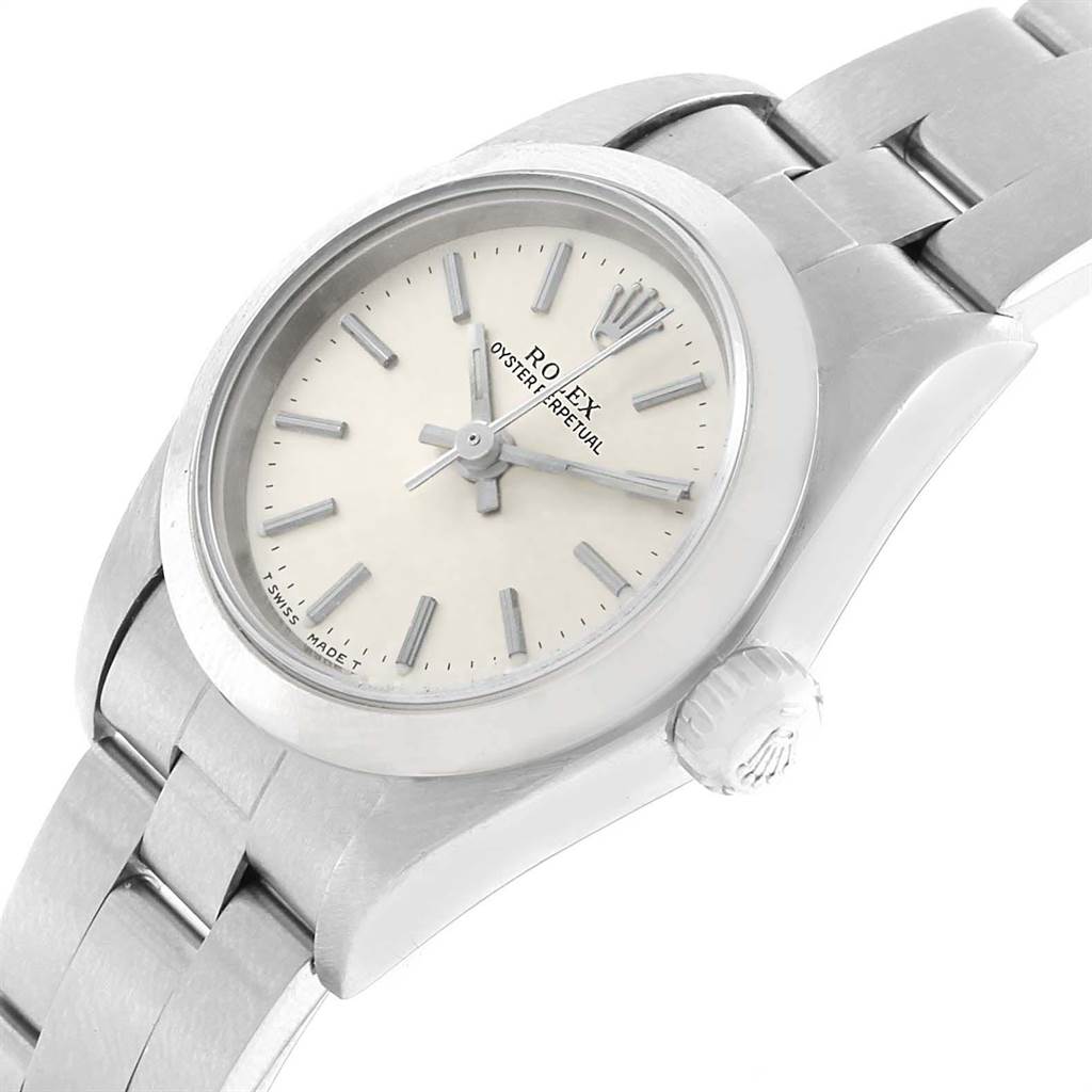 The image shows a close-up, top-side view of the Rolex Oyster Perpetual 67180 Women
s Stainless Steel Silver Dial 67180 Women
s Stainless Steel Silver Dial watch, highlighting the face, bezel, and part of the band.