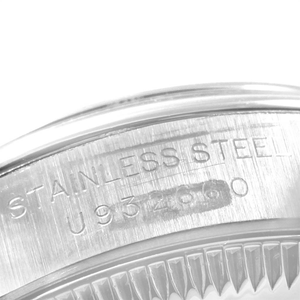 This image shows a close-up of the case back engraving on a Rolex Oyster Perpetual 67180 Women
s Stainless Steel Silver Dial 67180 Women
s Stainless Steel Silver Dial watch, highlighting the stainless steel indication and serial number.