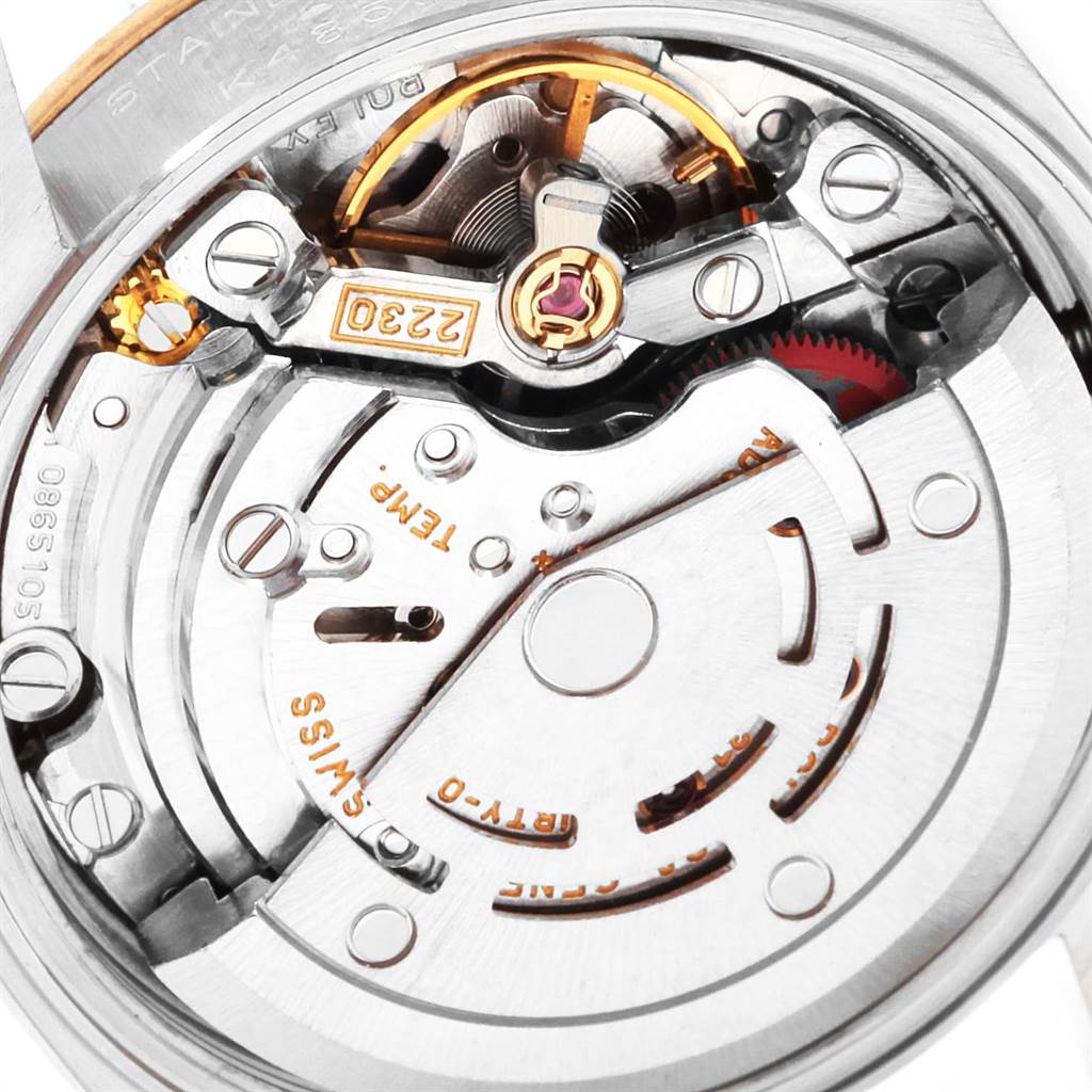 The image shows a close-up of the movement mechanism of the Rolex Oyster Perpetual 76193 Women
s Steel and Gold (two tone) Champagne Dial 76193 Women
s Steel and Gold (two tone) Champagne Dial watch.