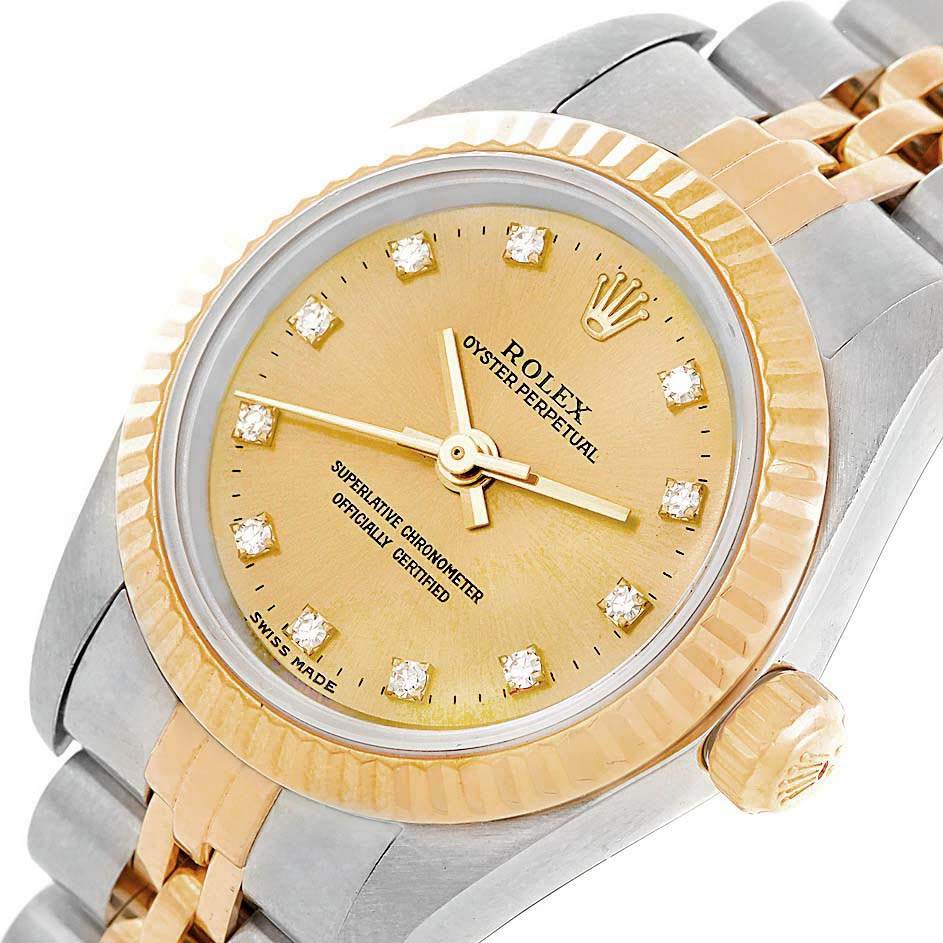The Rolex Oyster Perpetual 76193 Women
s Steel and Gold (two tone) Champagne Dial 76193 Women
s Steel and Gold (two tone) Champagne Dial watch is shown from a close-up front angle, displaying the face, bezel, crown, and bracelet.