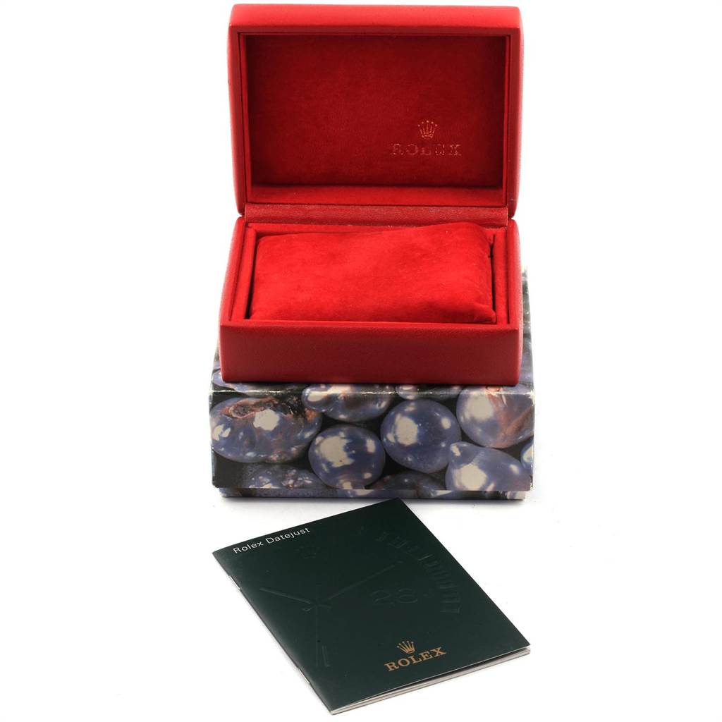 The image shows an empty Rolex Oyster Perpetual 76193 Women
s Steel and Gold (two tone) Champagne Dial 76193 Women
s Steel and Gold (two tone) Champagne Dial watch box, along with its outer packaging and a booklet.