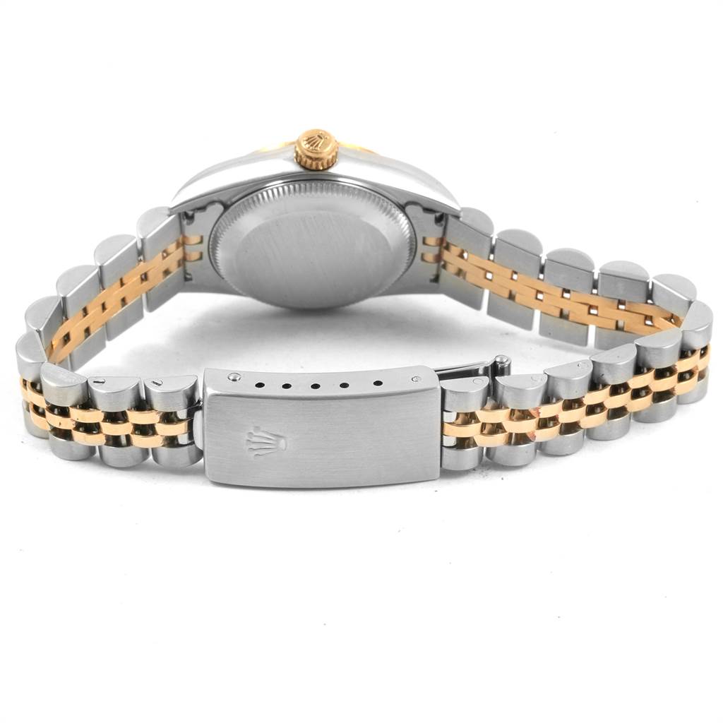 This image shows the back view of a Rolex Oyster Perpetual 76193 Women
s Steel and Gold (two tone) Champagne Dial 76193 Women
s Steel and Gold (two tone) Champagne Dial watch, focusing on the clasp and bracelet.