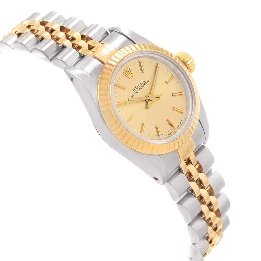 The image shows a Rolex Oyster Perpetual 67193 Women's Steel and Gold (two tone) Champagne Dial 67193 Women's Steel and Gold (two tone) Champagne Dial watch at a slight angle, highlighting its gold bezel, dial, and two-tone bracelet.