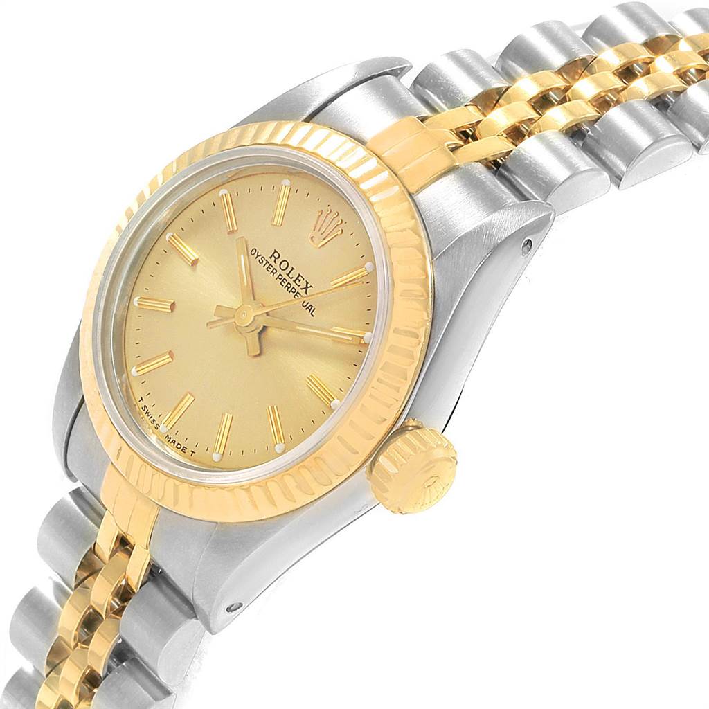 This image shows a close-up angled view of the Rolex Oyster Perpetual 67193 Women's Steel and Gold (two tone) Champagne Dial 67193 Women's Steel and Gold (two tone) Champagne Dial watch featuring the bezel, dial, and bracelet.