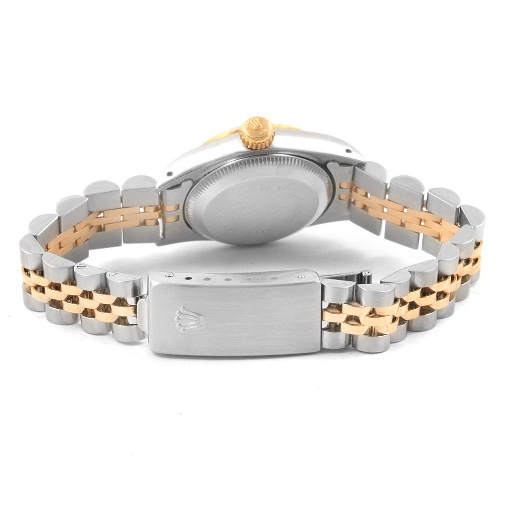 The image shows the back view of a Rolex Oyster Perpetual 67193 Women's Steel and Gold (two tone) Champagne Dial 67193 Women's Steel and Gold (two tone) Champagne Dial watch, focusing on the case back, crown, and two-tone bracelet clasp.