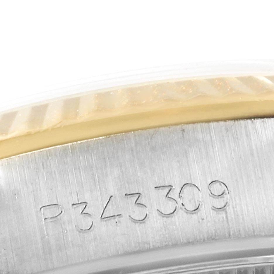 This image shows a close-up angle of the serial number and part of the bezel of the Rolex Oyster Perpetual 67193 Women's Steel and Gold (two tone) Champagne Dial 67193 Women's Steel and Gold (two tone) Champagne Dial watch.