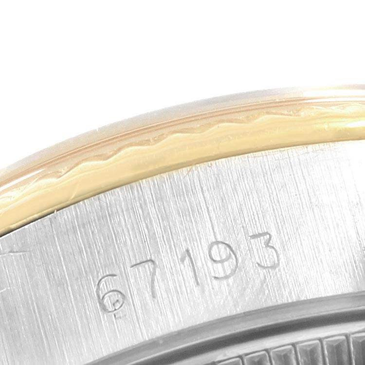 This image displays a close-up of the side view of the bezel and case back of a Rolex Oyster Perpetual 67193 Women's Steel and Gold (two tone) Champagne Dial 67193 Women's Steel and Gold (two tone) Champagne Dial, model 67193.