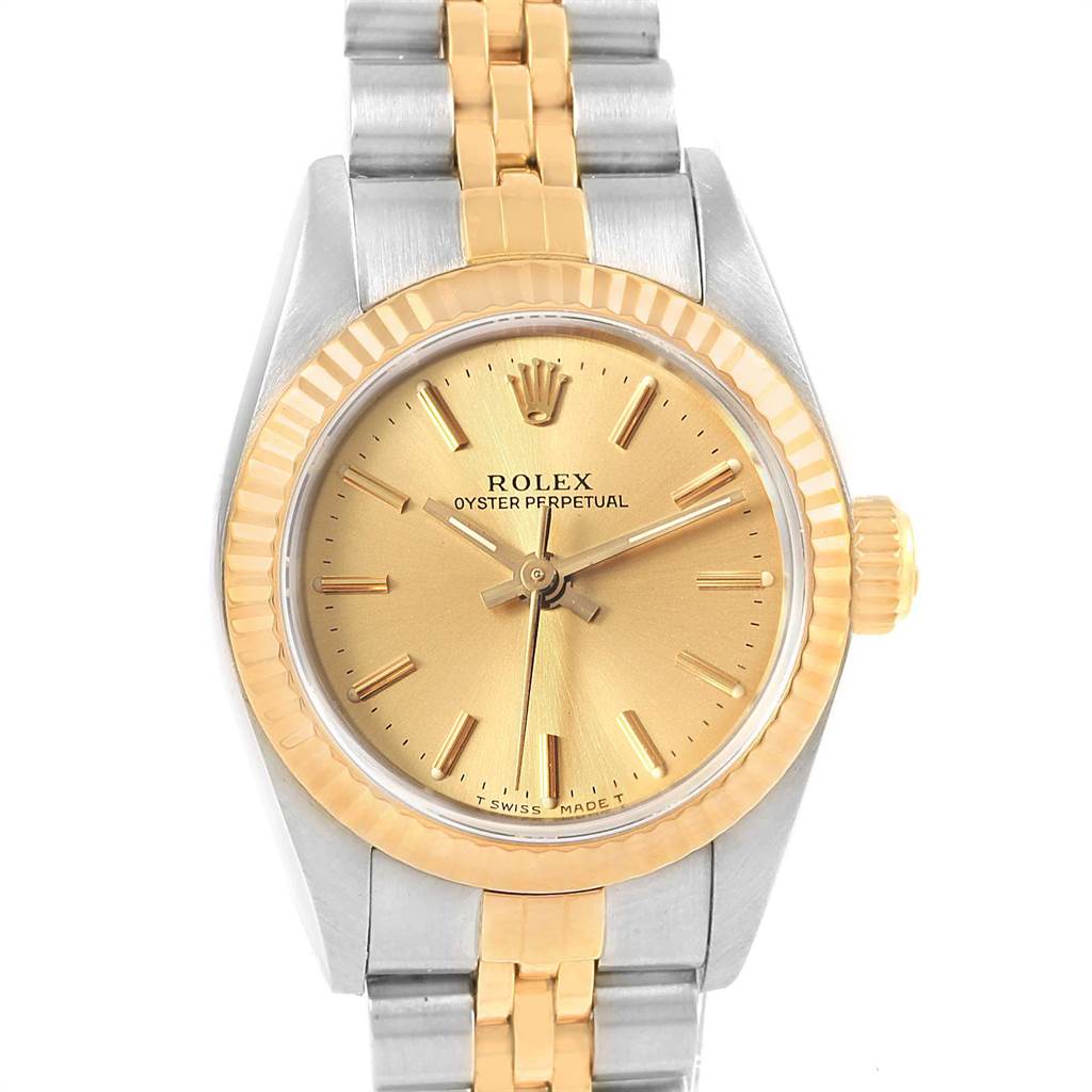 This image shows a frontal view of a Rolex Oyster Perpetual 67193 Women's Steel and Gold (two tone) Champagne Dial 67193 Women's Steel and Gold (two tone) Champagne Dial watch with a gold dial and two-tone metal band.