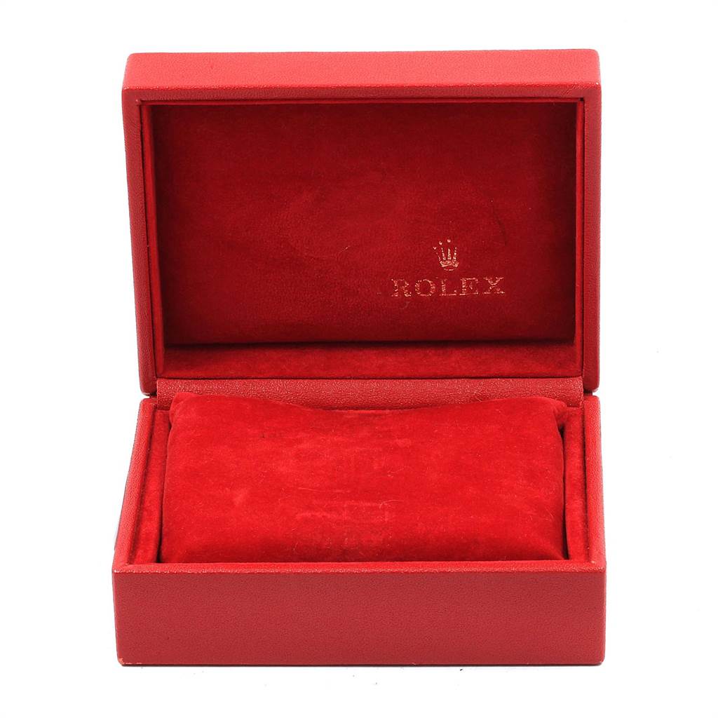 The image shows an open red Rolex watch box, likely for the Oyster Perpetual model.