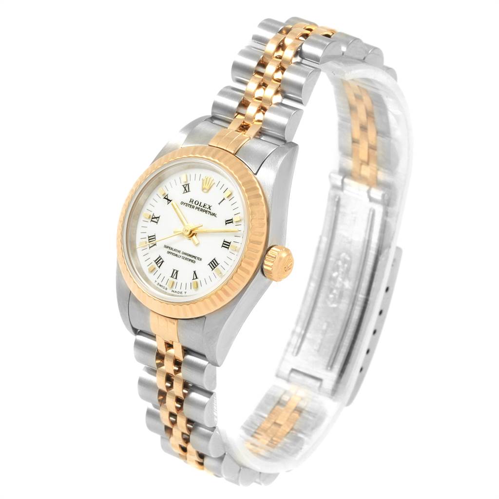 The image shows a Rolex Oyster Perpetual 76193 Women's Steel and Gold (two tone) White Dial 76193 Women's Steel and Gold (two tone) White Dial watch at a 3/4 angle, highlighting its two-tone bracelet and fluted bezel.