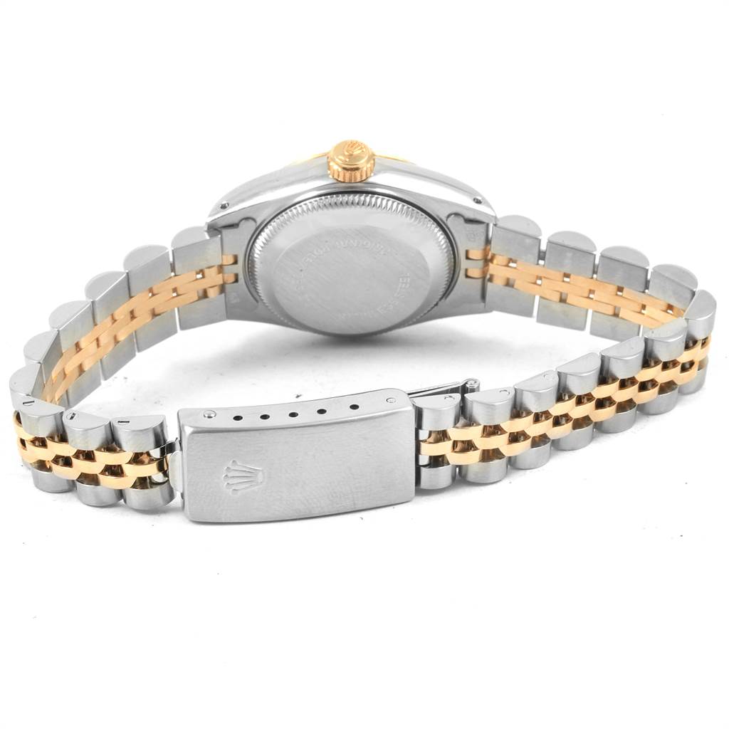 The image shows the back of a Rolex Oyster Perpetual 69173 Women's Stainless Steel Champagne Dial 69173 Women's Stainless Steel Champagne Dial watch, highlighting the case back, crown, and the two-tone bracelet with a clasp.