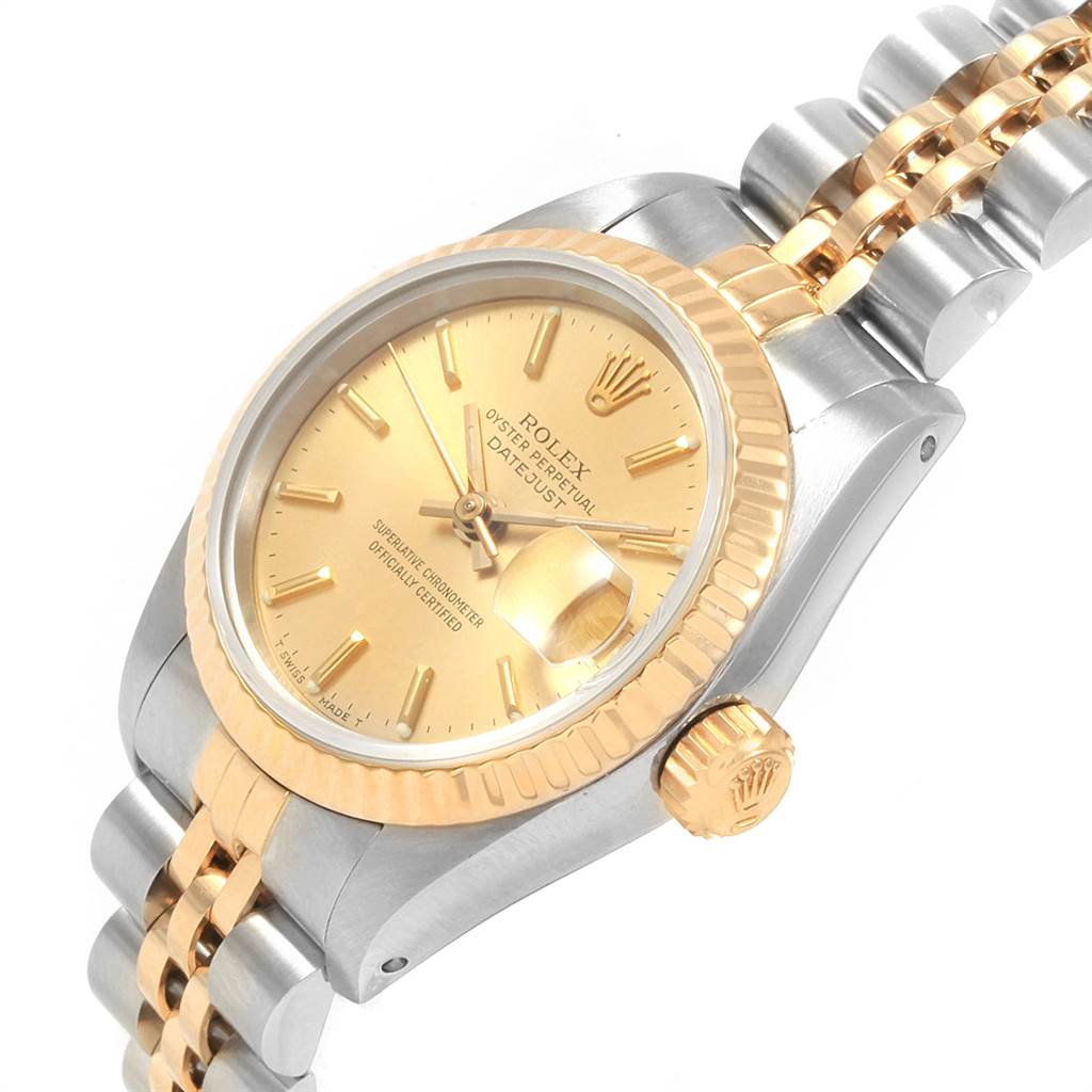 This image shows the Rolex Oyster Perpetual 69173 Women's Stainless Steel Champagne Dial 69173 Women's Stainless Steel Champagne Dial watch from an angled side view, displaying the dial, crown, and part of the bracelet.