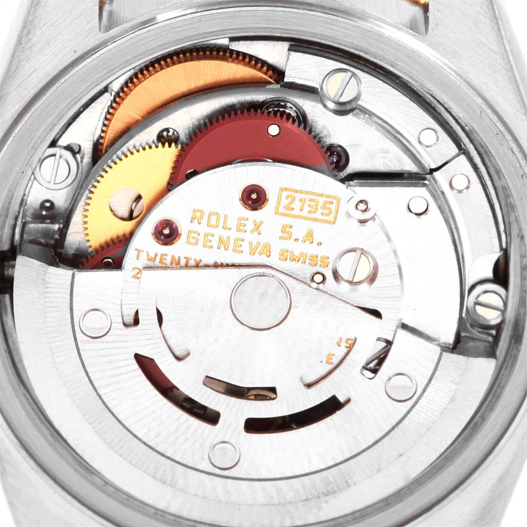 This image shows a close-up view of the movement mechanism of a Rolex Oyster Perpetual 69173 Women's Stainless Steel Champagne Dial 69173 Women's Stainless Steel Champagne Dial watch.