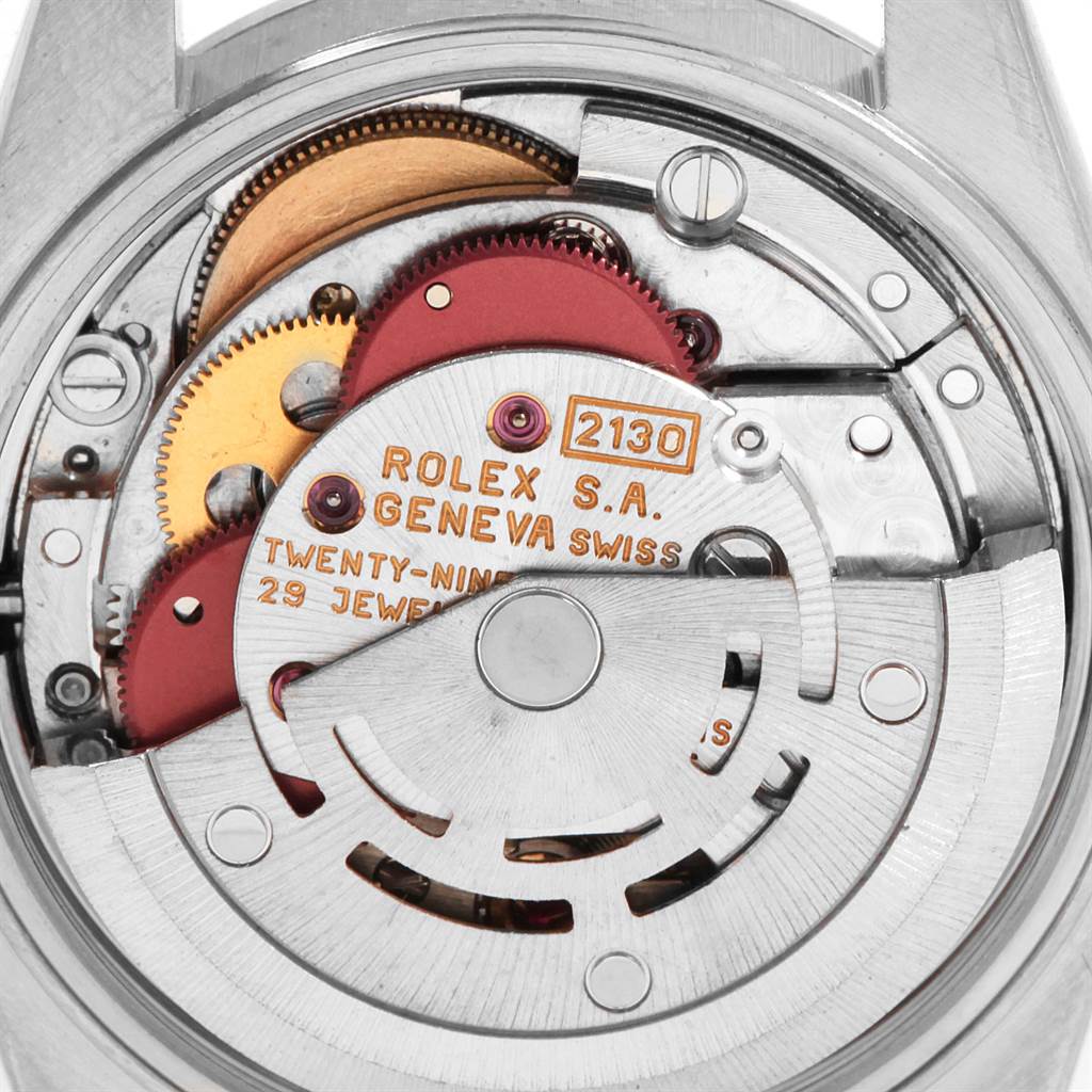 This image shows the inner mechanical movement of a Rolex Oyster Perpetual 67193 Women's Steel and Gold (two tone) White Dial 67193 Women's Steel and Gold (two tone) White Dial watch, highlighting gears and the rotor.