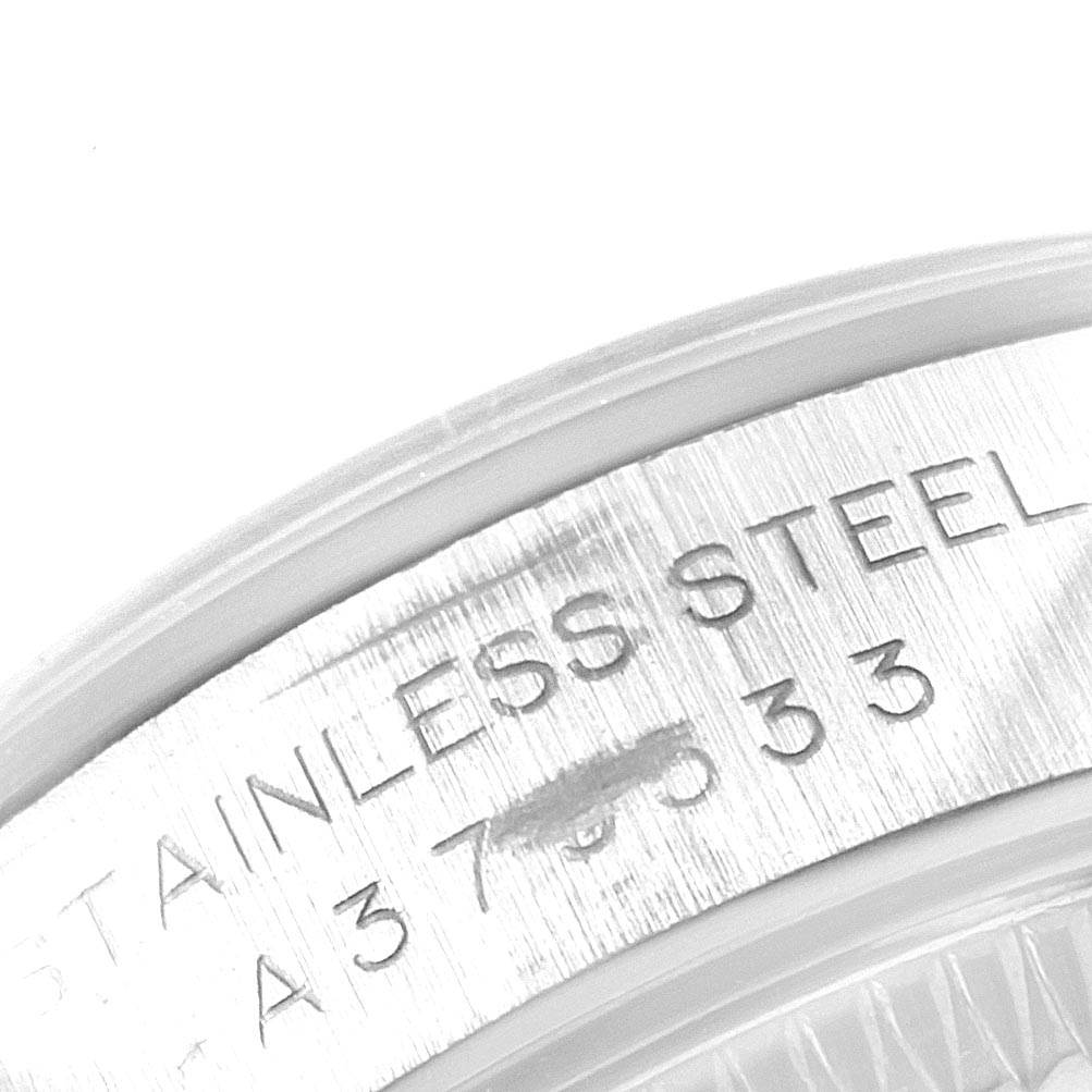 This close-up image shows the engraved stainless steel case back of a Rolex Oyster Perpetual 76080 Women
s Stainless Steel Black Dial 76080 Women
s Stainless Steel Black Dial watch.