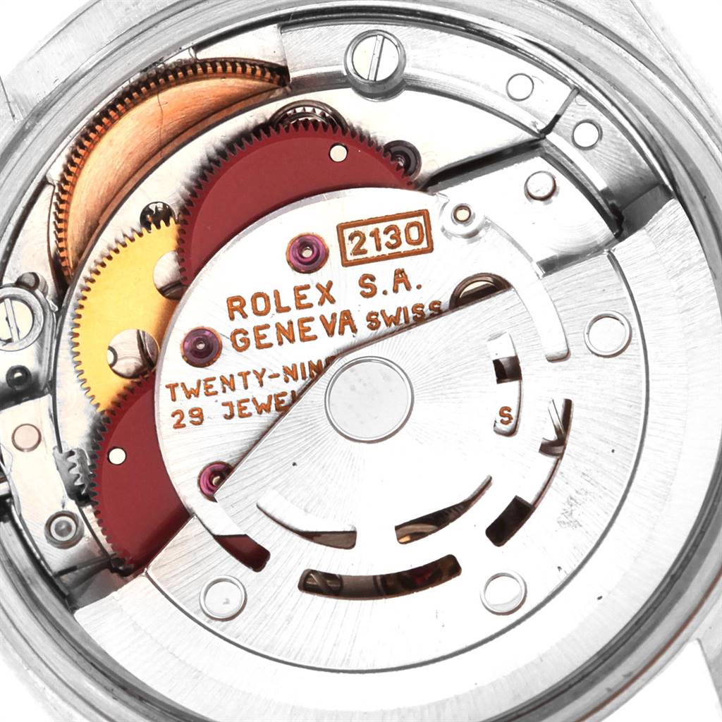 This image shows the internal movement mechanism of a Rolex Oyster Perpetual 67230 Women
s Stainless Steel Blue Dial 67230 Women
s Stainless Steel Blue Dial watch.