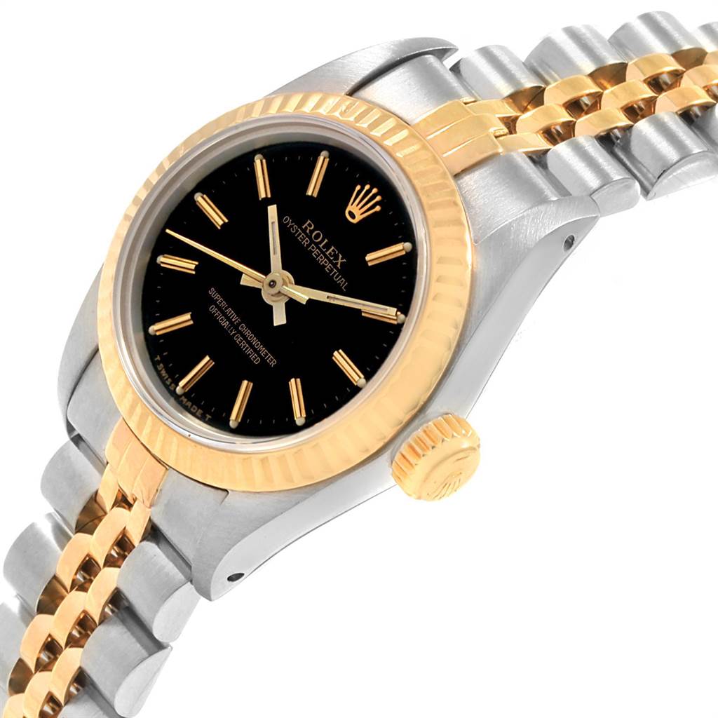 The Rolex Oyster Perpetual 67193 Women
s Steel and Gold (two tone) Black Dial 67193 Women
s Steel and Gold (two tone) Black Dial watch is shown at an angled view, highlighting the dial, bezel, crown, and part of the bracelet.