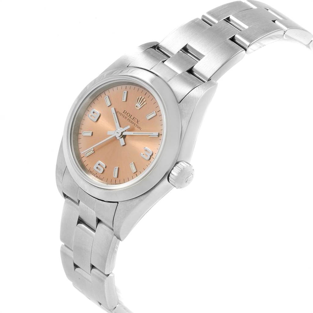 The Rolex Oyster Perpetual 76080 Women
s Stainless Steel Pink Dial 76080 Women
s Stainless Steel Pink Dial watch is shown at an angled view, highlighting the dial, crown, and part of the bracelet.