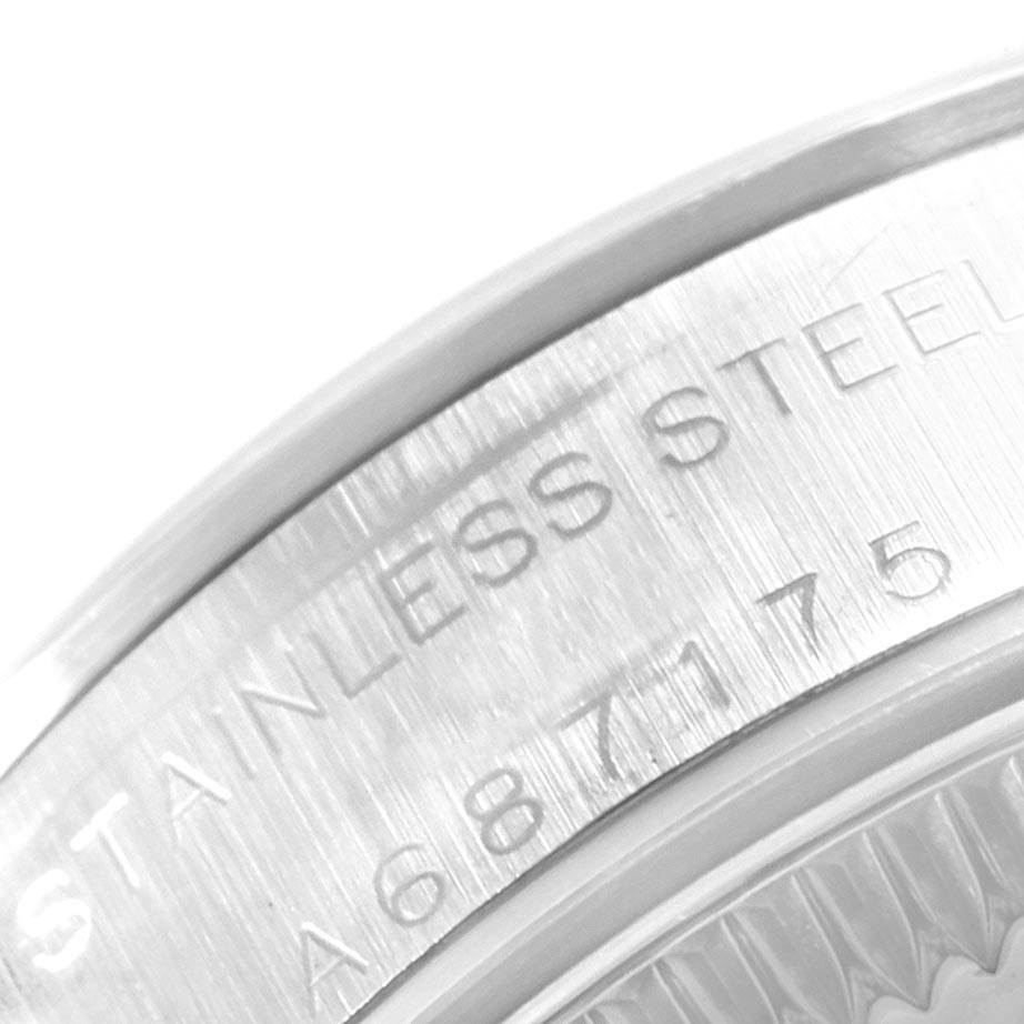 The image shows a close-up angle of the back case engraving on a Rolex Oyster Perpetual 76080 Women
s Stainless Steel Pink Dial 76080 Women
s Stainless Steel Pink Dial watch, highlighting the stainless steel and model details.