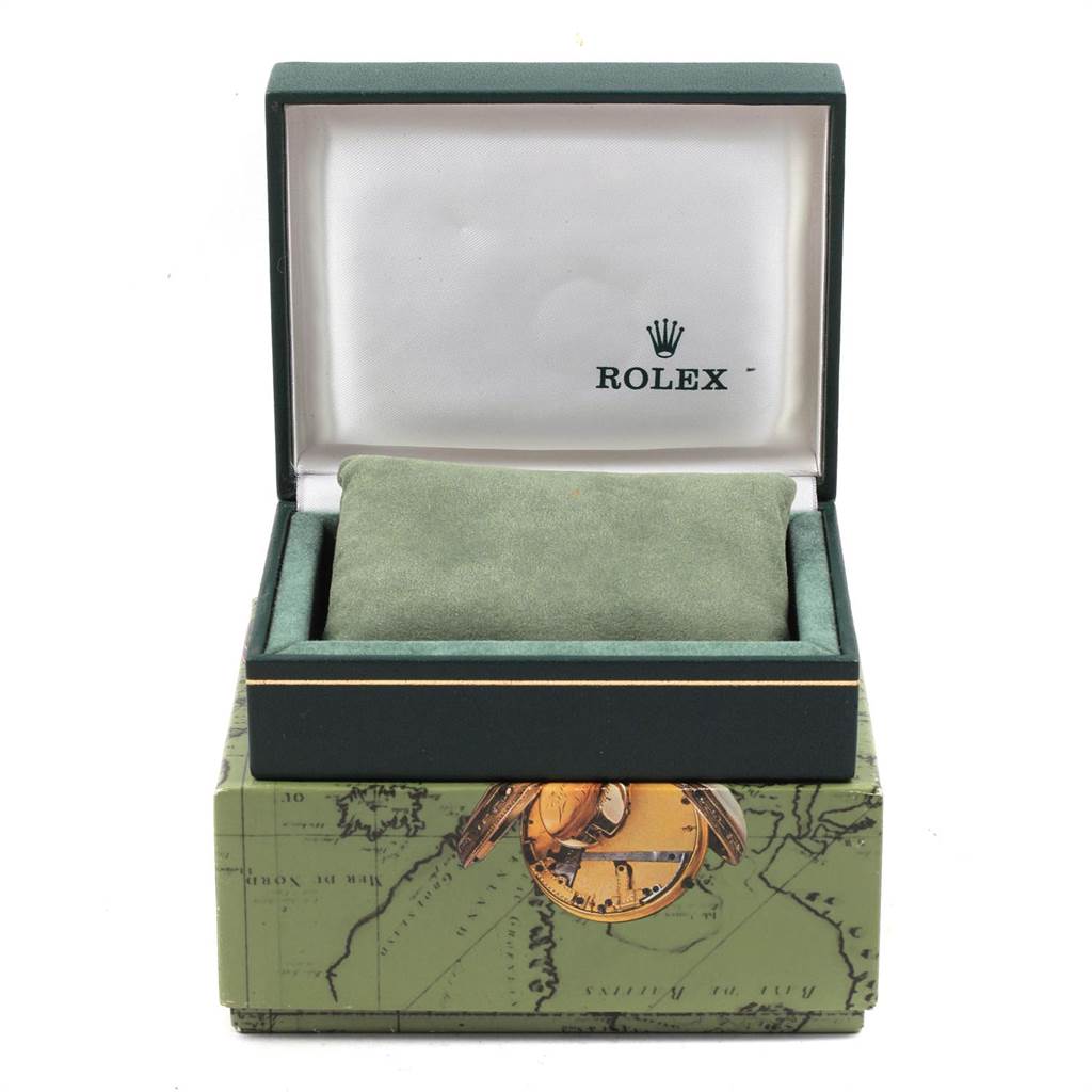 The image shows the open box and cushion for a Rolex Oyster Perpetual 76080 Women
s Stainless Steel Pink Dial 76080 Women
s Stainless Steel Pink Dial watch, highlighting the brand
s logo on the interior lid.