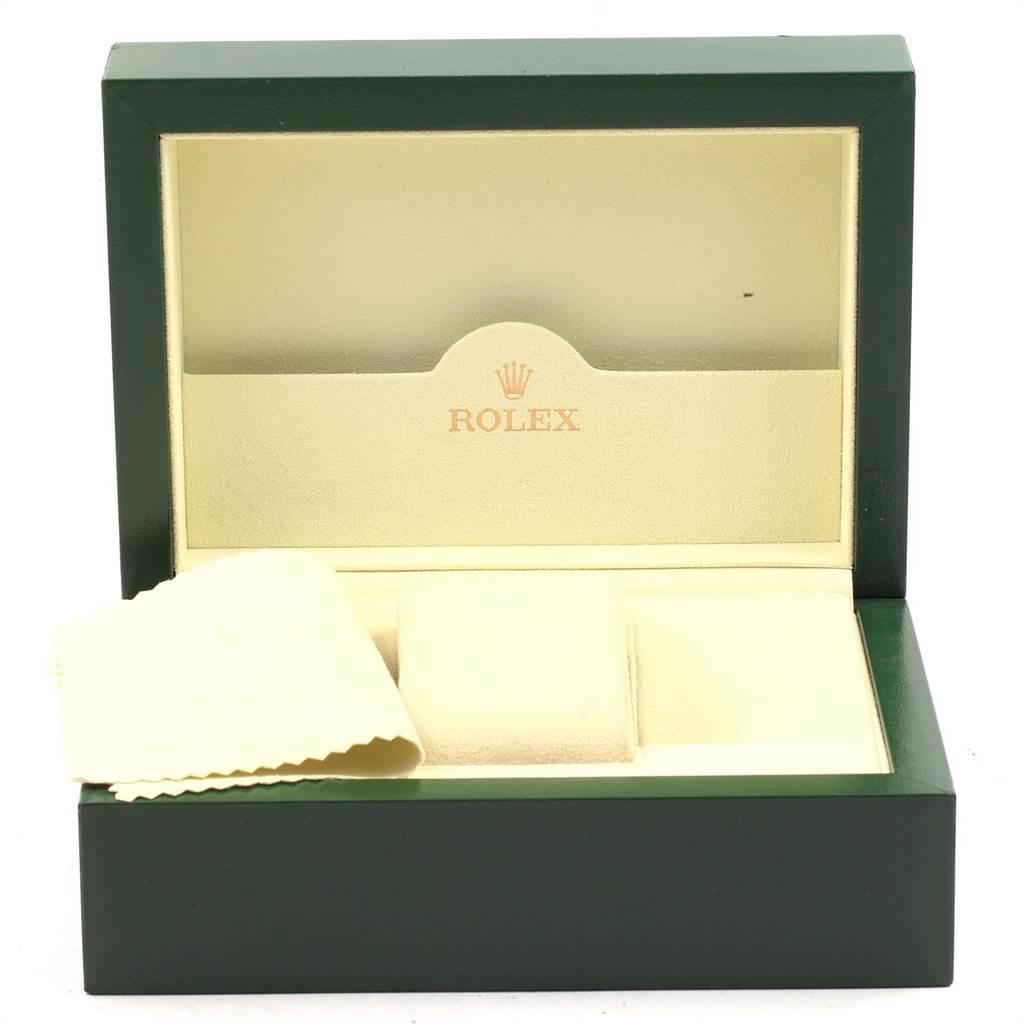 This image shows the open green and beige box for a Rolex Oyster Perpetual 176234 Women
s Stainless Steel Silver Dial 176234 Women
s Stainless Steel Silver Dial watch, including a cleaning cloth.