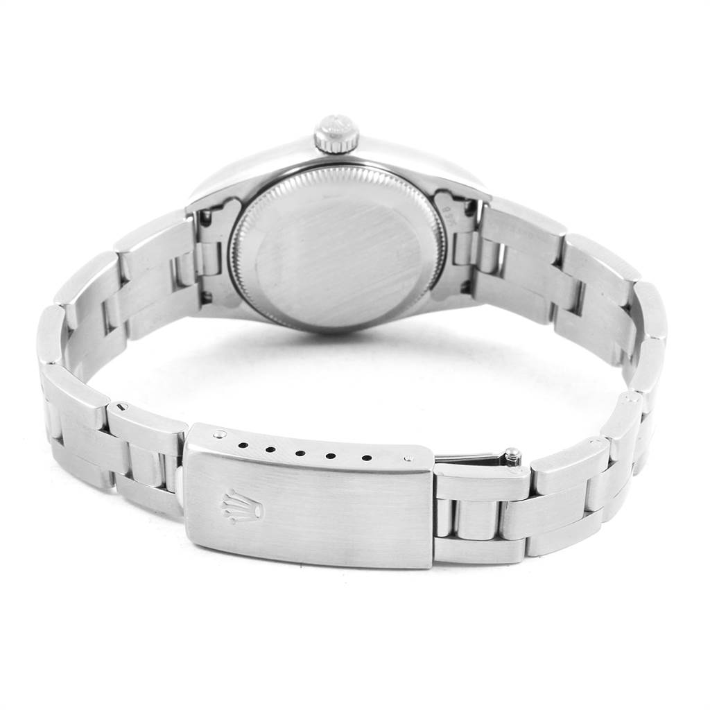 The image shows the backside of the Rolex Oyster Perpetual 76080 Women
s Stainless Steel Pink Dial 76080 Women
s Stainless Steel Pink Dial watch, including the case back and clasp on the bracelet.