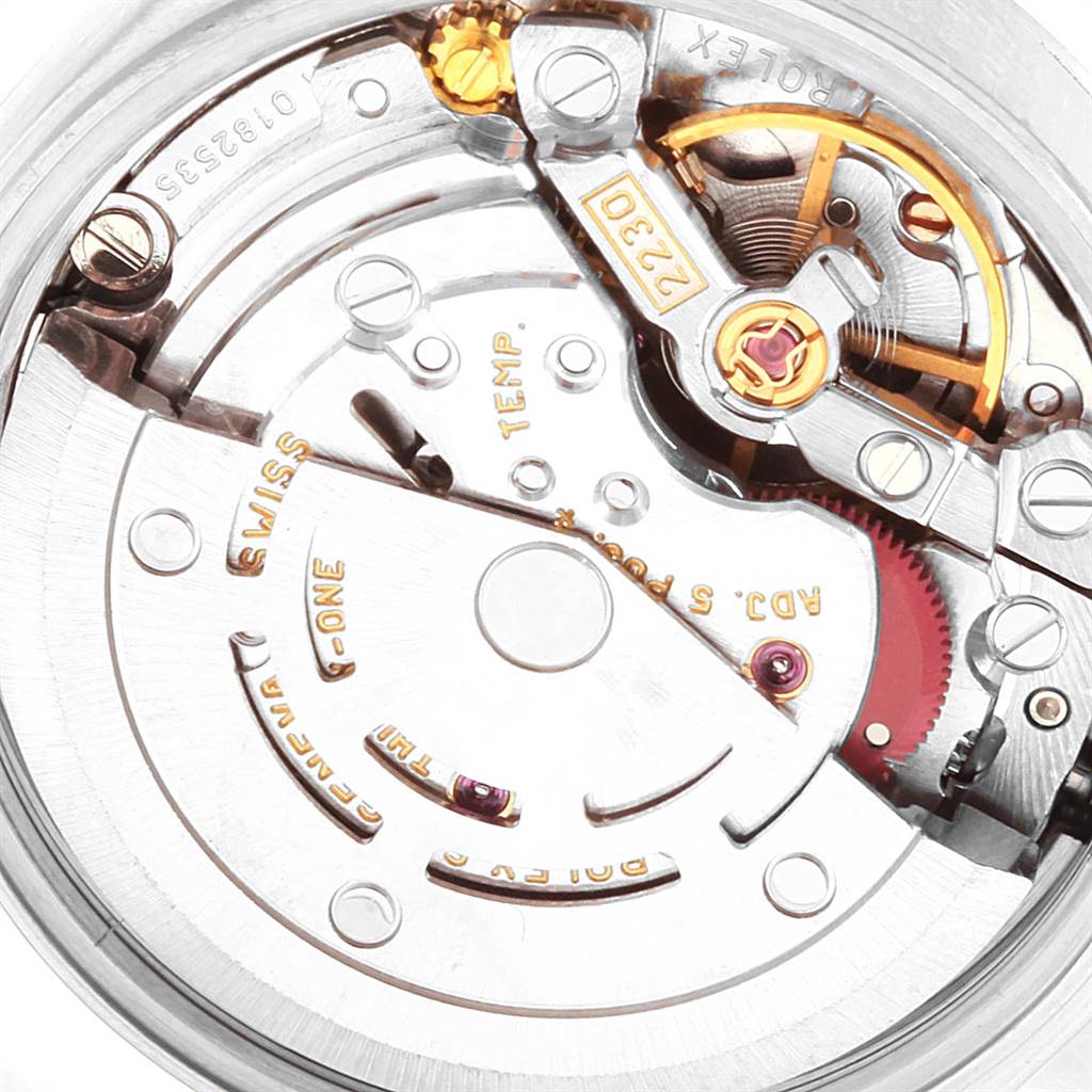 Close-up of the Rolex Oyster Perpetual 76080 Women
s Stainless Steel Pink Dial 76080 Women
s Stainless Steel Pink Dial watch movement, focusing on its internal mechanical components including gears and springs.