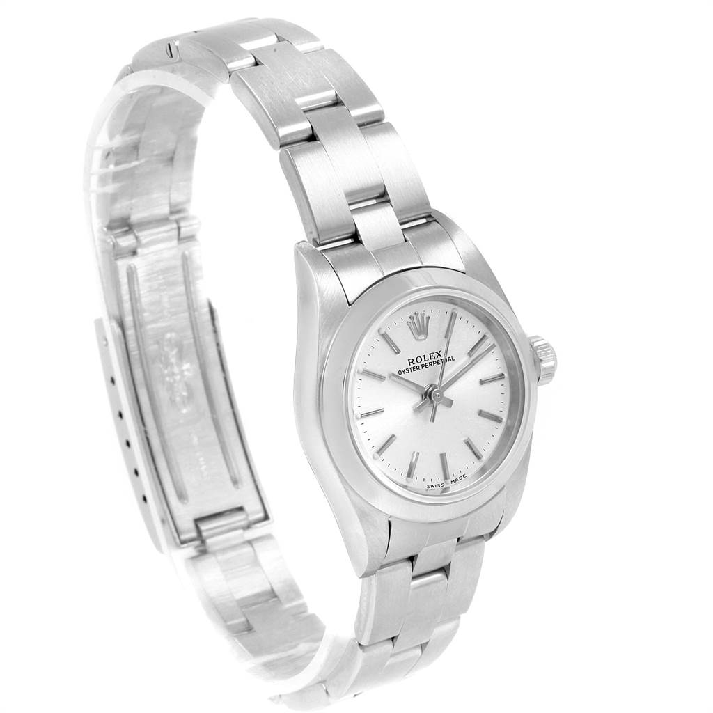 The Rolex Oyster Perpetual 76080 Women's Stainless Steel Silver Dial 76080 Women's Stainless Steel Silver Dial watch is pictured from a slightly tilted angle, showcasing the face, bezel, crown, and bracelet.