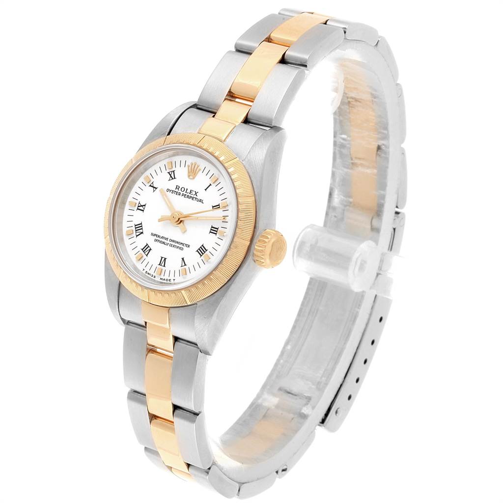 The Rolex Oyster Perpetual 67243 Women
s Steel and Gold (two tone) White Dial 67243 Women
s Steel and Gold (two tone) White Dial watch is shown at a slight angle, displaying the face, bezel, crown, and part of the bracelet.