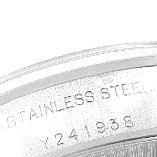 This close-up image shows the outer rim of the Rolex Oyster Perpetual 76080 Women
s Stainless Steel Black Dial 76080 Women
s Stainless Steel Black Dial watch with engraving details.