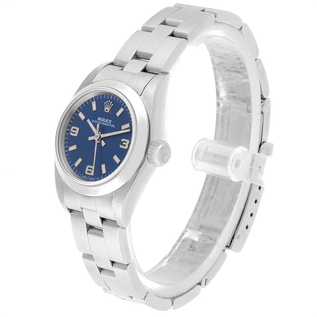 The Rolex Oyster Perpetual 67180 Women
s Stainless Steel Blue Dial 67180 Women
s Stainless Steel Blue Dial watch is shown at a slightly tilted front angle, highlighting its face, crown, and bracelet.
