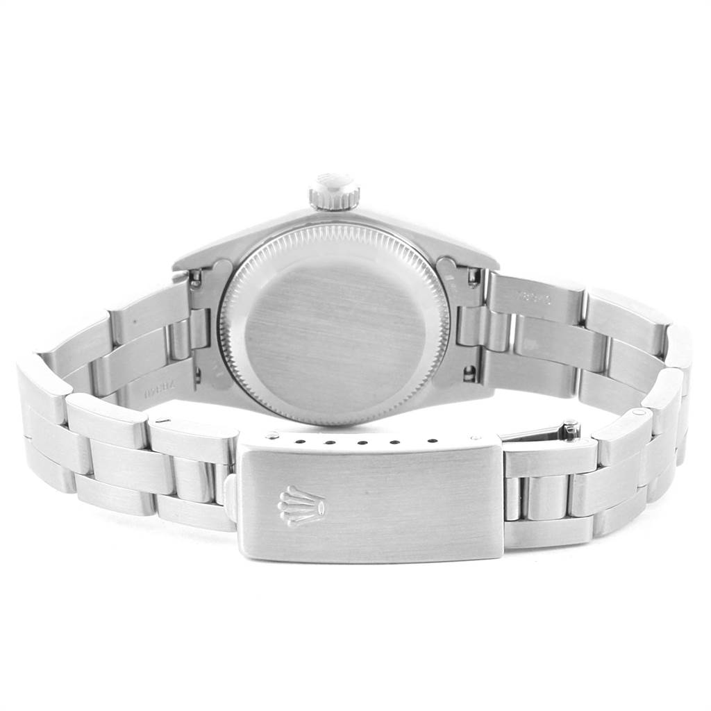 The image shows the back case, crown, and bracelet clasp of a Rolex Oyster Perpetual 67180 Women
s Stainless Steel Blue Dial 67180 Women
s Stainless Steel Blue Dial watch from a rear angle.