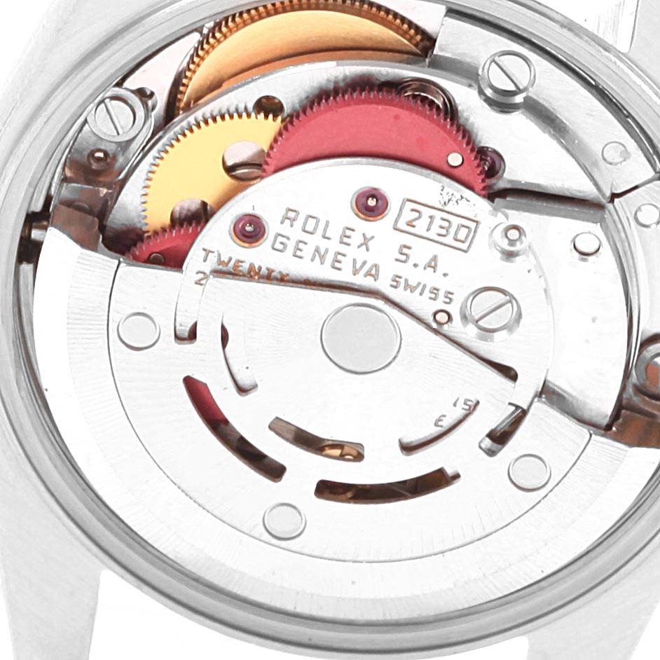 This image shows a close-up view of the movement and internal components of a Rolex Oyster Perpetual 67180 Women
s Stainless Steel Blue Dial 67180 Women
s Stainless Steel Blue Dial watch.