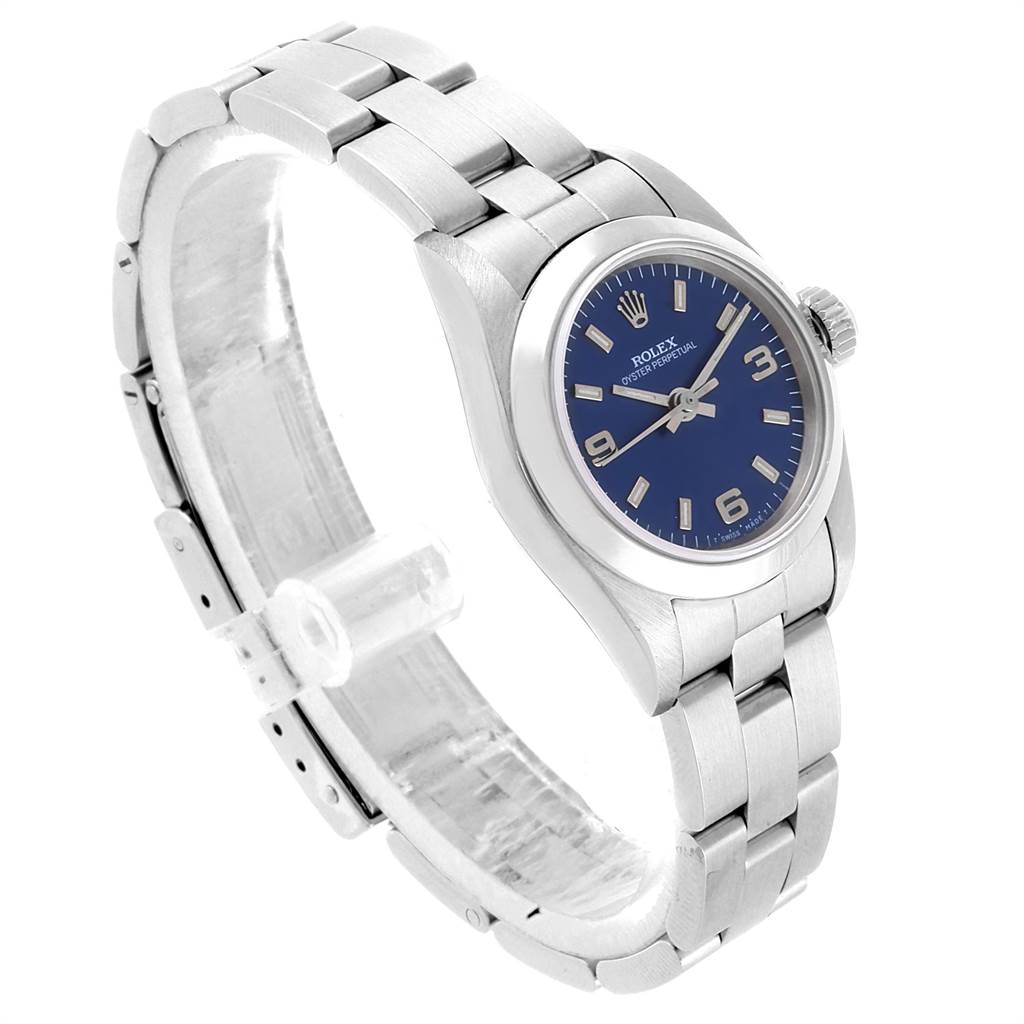 The image shows a Rolex Oyster Perpetual 67180 Women
s Stainless Steel Blue Dial 67180 Women
s Stainless Steel Blue Dial watch at a three-quarter angle, highlighting the dial, case, and bracelet.