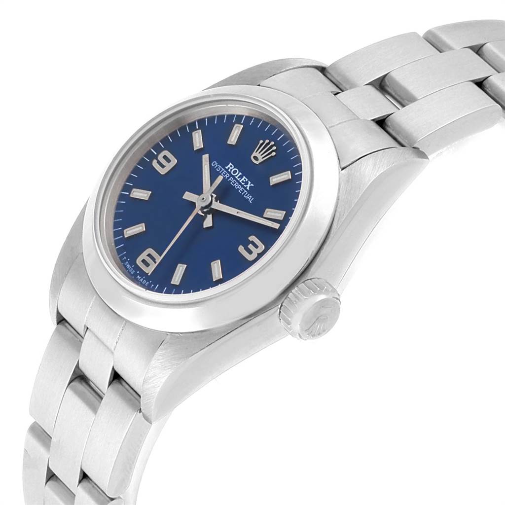 This image shows a Rolex Oyster Perpetual 67180 Women
s Stainless Steel Blue Dial 67180 Women
s Stainless Steel Blue Dial watch at an angled side view, displaying the dial, crown, and part of the bracelet.