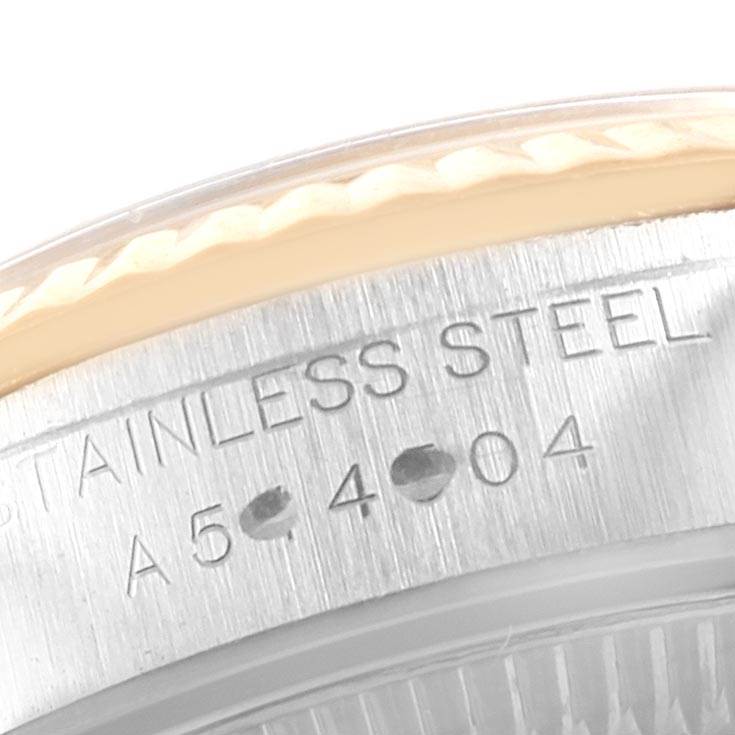 This image shows a close-up of the stainless steel case with engravings on the Rolex Oyster Perpetual 76193 Women
s Steel and Gold (two tone) Champagne Dial 76193 Women
s Steel and Gold (two tone) Champagne Dial watch.