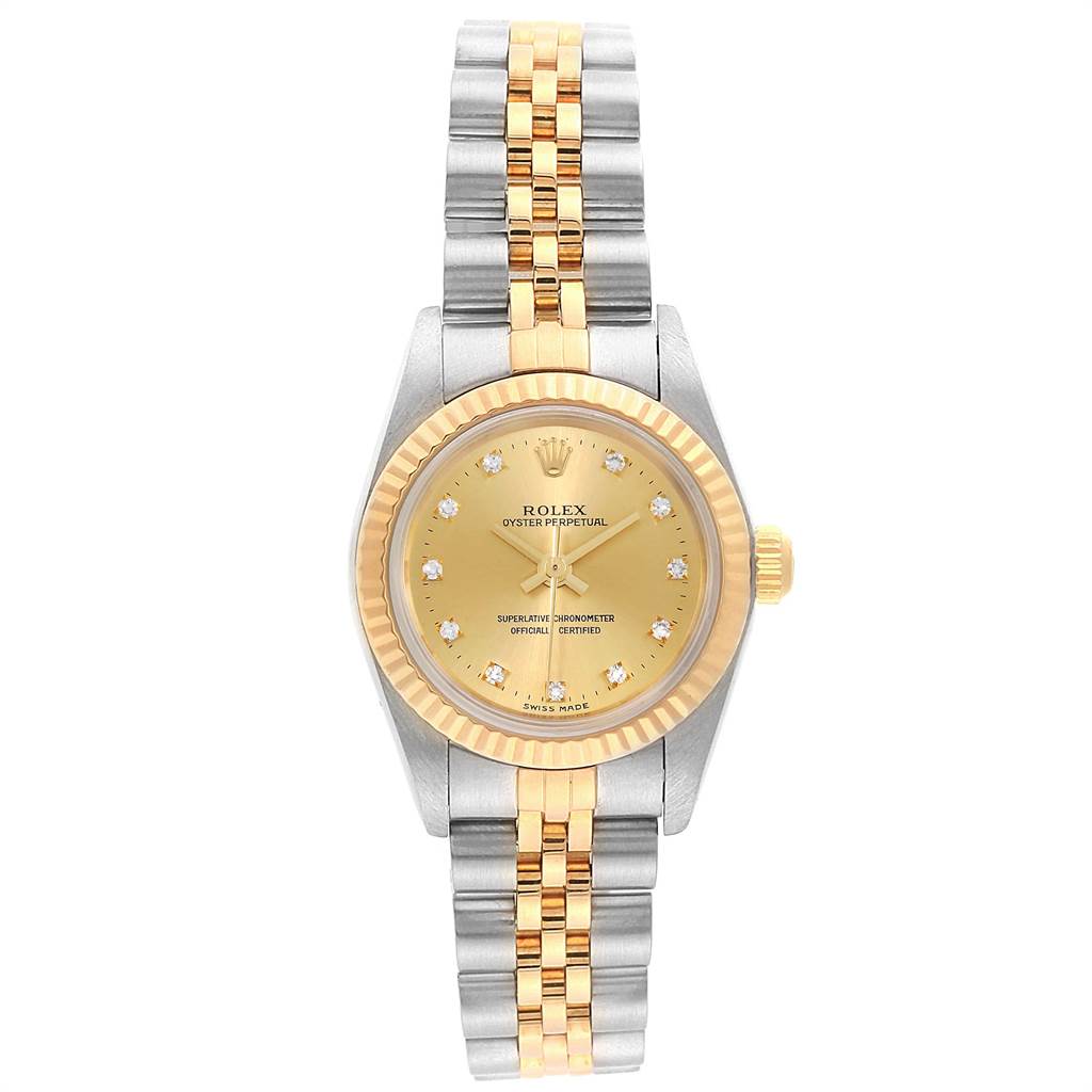 The image shows a front view of a Rolex Oyster Perpetual 76193 Women
s Steel and Gold (two tone) Champagne Dial 76193 Women
s Steel and Gold (two tone) Champagne Dial watch with a gold and silver two-tone bracelet and a diamond hour-marked dial.