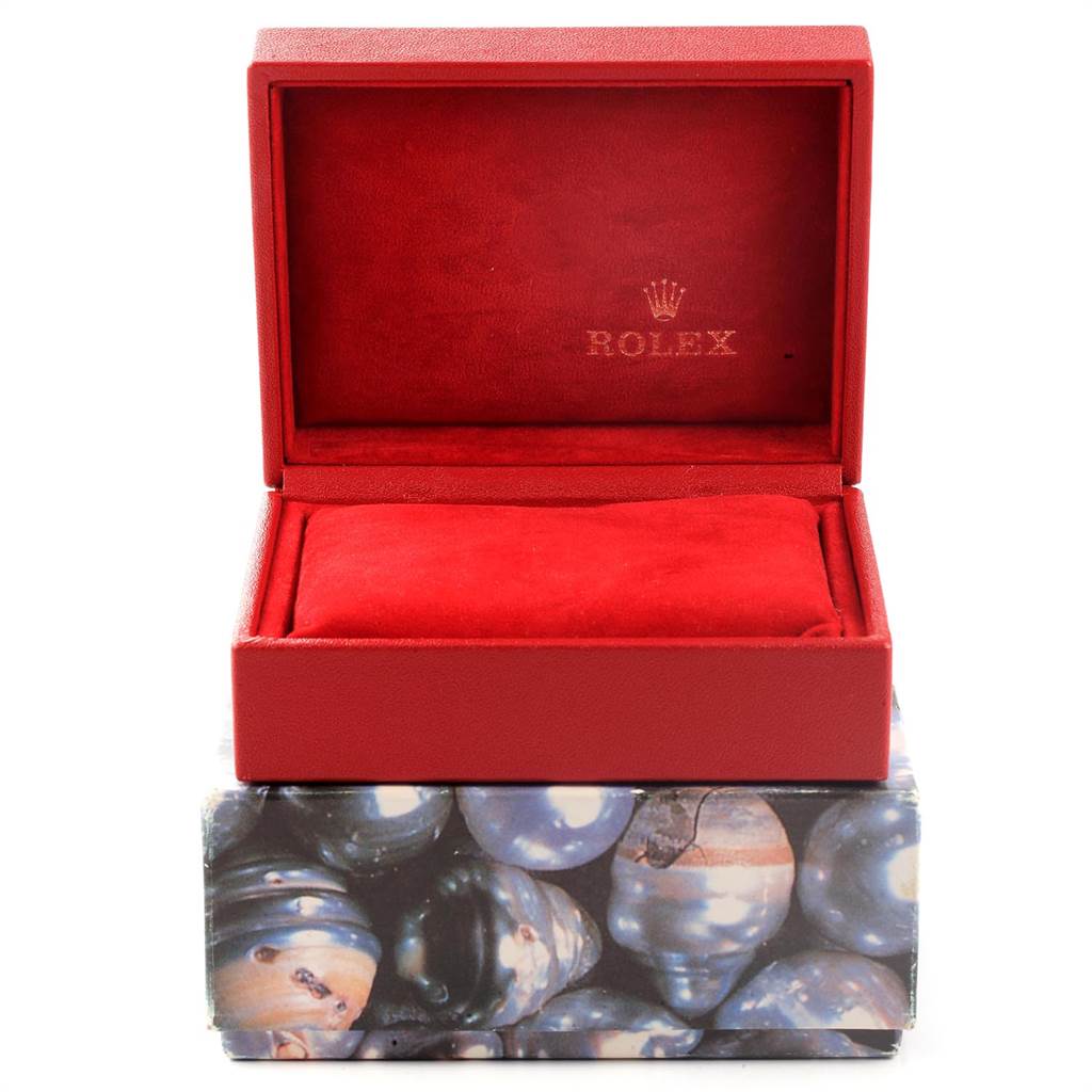 This image shows an open red Rolex box for the Oyster Perpetual model, displayed from the front angle.