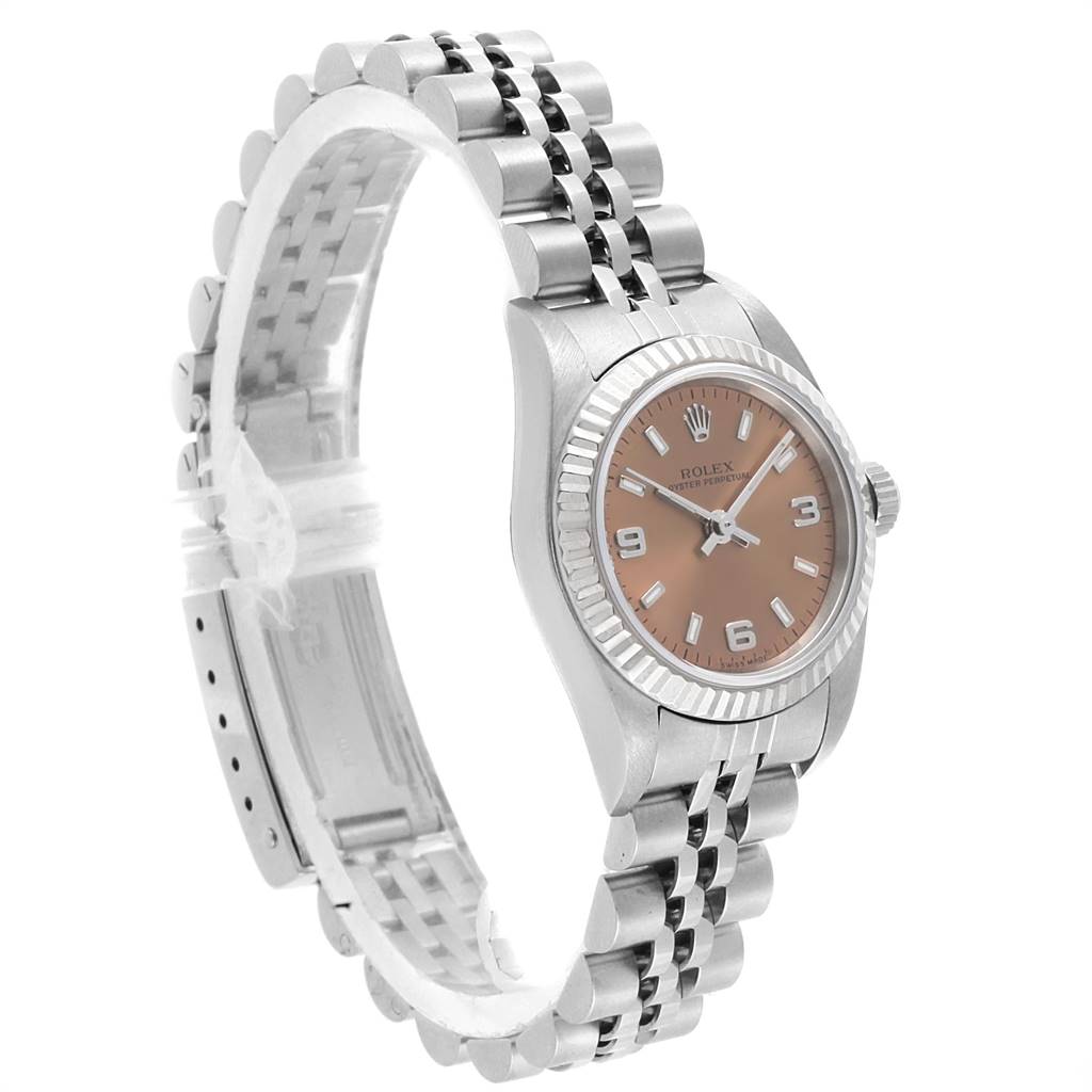 The image shows a side angle of a Rolex Oyster Perpetual 76094 Women's Stainless Steel Pink Dial 76094 Women's Stainless Steel Pink Dial watch, highlighting the case, dial, bezel, crown, and bracelet.